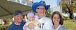 <p>President Lester A. Lefton poses for a photo with Kent State alumni along the Homecoming parade route.</p>