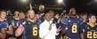 Kent State head football coach Darrell Hazell joins the team in singing the Kent State fight song after defeating the University of Akron.