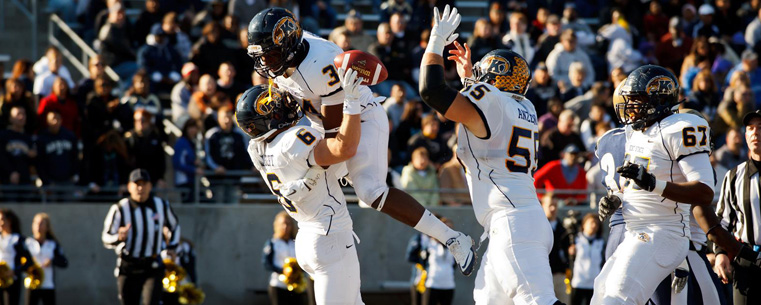 <p>Kent State players celebrate a touchdown.</p>