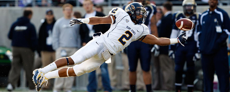 <p>A Kent State defender dives for the ball in the 2011 game.</p>