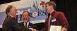 Eric Johnston, a senior Kent State University student majoring in music, accepts an award from Glenn Saltzman, Ph.D., during the American Red Cross of Summit and Portage Counties’ 2012 Real Heroes Breakfast event. Johnston rescued a girl from drowning in the Cuyahoga River in Kent.