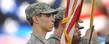 A member of the Kent State Army ROTC stands at attention during the playing of the National Anthem at a home football game.