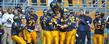 Members of the Golden Flashes celebrate a touchdown during their win against Bowling Green Saturday.