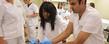 Students in Kent State's College of Nursing practice inserting a catheter into a simulated patient during class.