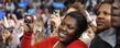 An Obama supporter takes photos of the president while he is speaking in the MAC Center.