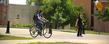 Kent State University students walk and bike to class along the University Esplanade.