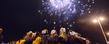 Members of the Kent State cheerleading squad watch fireworks over Mobile Bay during a pep rally.