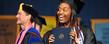 A Kent State graduate smiles in the direction of her family during commencement ceremonies Saturday morning.