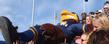 Flash "crowd surfs" in the student section during a football game at Dix Stadium.