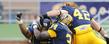 Kent State wide receiver Chris Gilbert and teammates celebrate the Golden Flashes go-ahead score in the fourth quarter of the 28-22 victory at Dix Stadium.