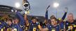 Kent State players celebrate on the field after going undefeated in the month of November.