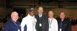 Kent State head football coach Darrell Hazell (second from left) and Kent State Senior Vice President for Academic Affairs and Provost Todd Diacon (center) gather with Vice President Vincent Hetherington (far left), President Thomas Melillo (far right) and Executive Vice President David Nicolanti (second from right) of the Ohio College of Podiatric Medicine in the Kent State Field House.