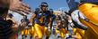 <p>Kent State football players are welcomed onto the field by fans gathered in the end zone at Dix Stadium.</p>