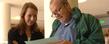 <p>A Kent State University student and her parent look over campus information during a Parents’ and Family Day visit.<br />
</p>