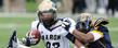 The Kent State defense swarms a University of Akron player during a 35-24 win at Dix Stadium.