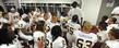 <p>Coach Darrell Hazell gives the Golden Flashes a last minute talk before the Alabama game.</p>