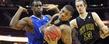 Kent State’s Darren Goodson scrambles for control of a loose ball, along with teammate Mark Henniger (13) , during the Golden Flashes 70-68 victory over Buffalo in the quarterfinal game of the Mid-American Conference Tournament in Cleveland.