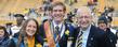 President Lefton congratulates Homecoming King Tom Ream and Queen Ann Miller during the halftime ceremony at Dix Stadium.