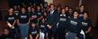 <p>Keynote speaker Dr. Marc Lamont Hill gathers for a photo with local students following the Martin Luther King Jr. Celebration in the Kent Student Center Ballroom.</p>