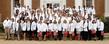 Students from the Ohio College of Podiatric Medicine pose for a class photo on the college's front steps following a White Coat Ceremony. The White Coat Ceremony signifies the transition from undergraduate and/or pre-professional life to the start of a professional life. (Photo courtesy of the Ohio College of Podiatric Medicine)