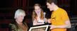 <p>Students present Kent State benefactor Roe Green with a photograph of students enrolled in the School of Theatre and Dance.</p>