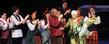 <p>Cast members from the production of "Brigadoon" present flowers to benefactor Roe Green during a standing ovation for her contributions to Kent State.<br />
</p>