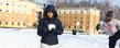 Students have a snowball fight near Centennial Court.