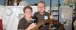 <p>Guests at the President Lefton's Cleveland Tall Ships Festival reception pose behind the wheel of the Roald Amundsen, a tall ship from Germany.</p>