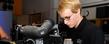 A TeleProductions staff member uses one of the video cameras inside a studio in the Music and Speech Center.