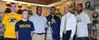 (left to right) Kent State’s Samuel Allen, Mack McGuire, head football coach Paul Haynes, Devareaux Manley, Director of Athletics Joel Nielsen and Tyshon Goode gather around the 2012-13 Reese Trophy in the Memorial Athletic and Convocation Center.