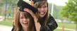 <p>Two friends celebrate graduating from Kent State in Risman Plaza.<br />
</p>