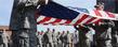 Members of the Kent State ROTC detachment stand at attention during the raising of the United States flag, over Risman Plaza.