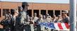 Members of the Kent State ROTC detachment stand at attention during the raising of the United States flag, over Risman Plaza.