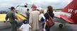 A family takes a close-up look at a Navy SNJ-4 trainer during a previous Aviation Heritage Fair.