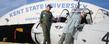 A visitor at a previous Aviation Heritage Fair checks out a vintage Navy SNJ-4 trainer at the Kent State University Airport. The plane belongs to the Cleveland Wing of the Commemorative Air Force.