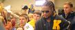 Joshua Cribbs is surrounded by a crush of fans in the Field House as he signs autographs before the game.