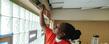 A Kent State student puts the finishing touches on the walls of the King Kennedy Community Center in Ravenna, Ohio.