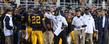 Kent State head football coach Darrell Hazell gives instruction to his team on the sidelines.