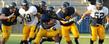 <p>Members of the Kent State Golden Flashes football team during a scrimmage game at Dix Stadium.</p>