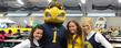 Flash, the Kent State University Golden Flashes mascot, joins members of the cheerleading squad to welcome students to the pre-game festivities in the Kent State Field House.