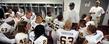 Head football coach Darrell Hazell goes over the game plan in the locker room prior to a game earlier this season.