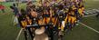 Members of the Kent State football team ring the Starner Victory Bell at the end of the final home game against Ohio University.