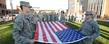 Two members of Kent State's ROTC Cadet Corps get ready to post the flag during the university's Veterans Day ceremony.