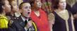 A member of the Kent State ROTC program sings along with the Kent State gospel choir during a previous event.