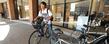 A student borrows a Flashfleet bike from the Kent Student Center. The bikes, which are free to use, must be returned to the original pick-up point.