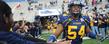 A fan greets a member of the Kent State Golden Flashes football team as they take the field for the 2009 game.