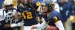 Kent State quarterback Spencer Keith runs the ball during a game against the University of Akron.