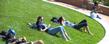 <p>Students relax in the grass area in the Risman Plaza in front of the Kent Student Center.<br />
</p>