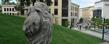 <p>Students pass by the sculpture “Athleta” by Ohio artist Giancarlo Calicchia near Kent Hall along the Kent State University Esplanade.</p>