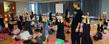 A yoga instructor walks his class through a series of exercises in Kent State’s Student Recreation and Wellness Center.